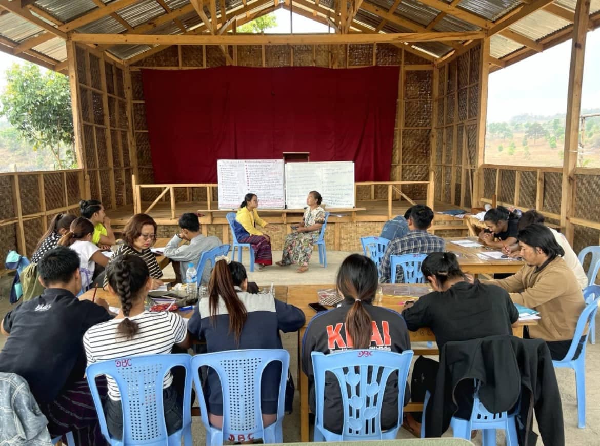 Community leaders meeting to plan local aid distribution