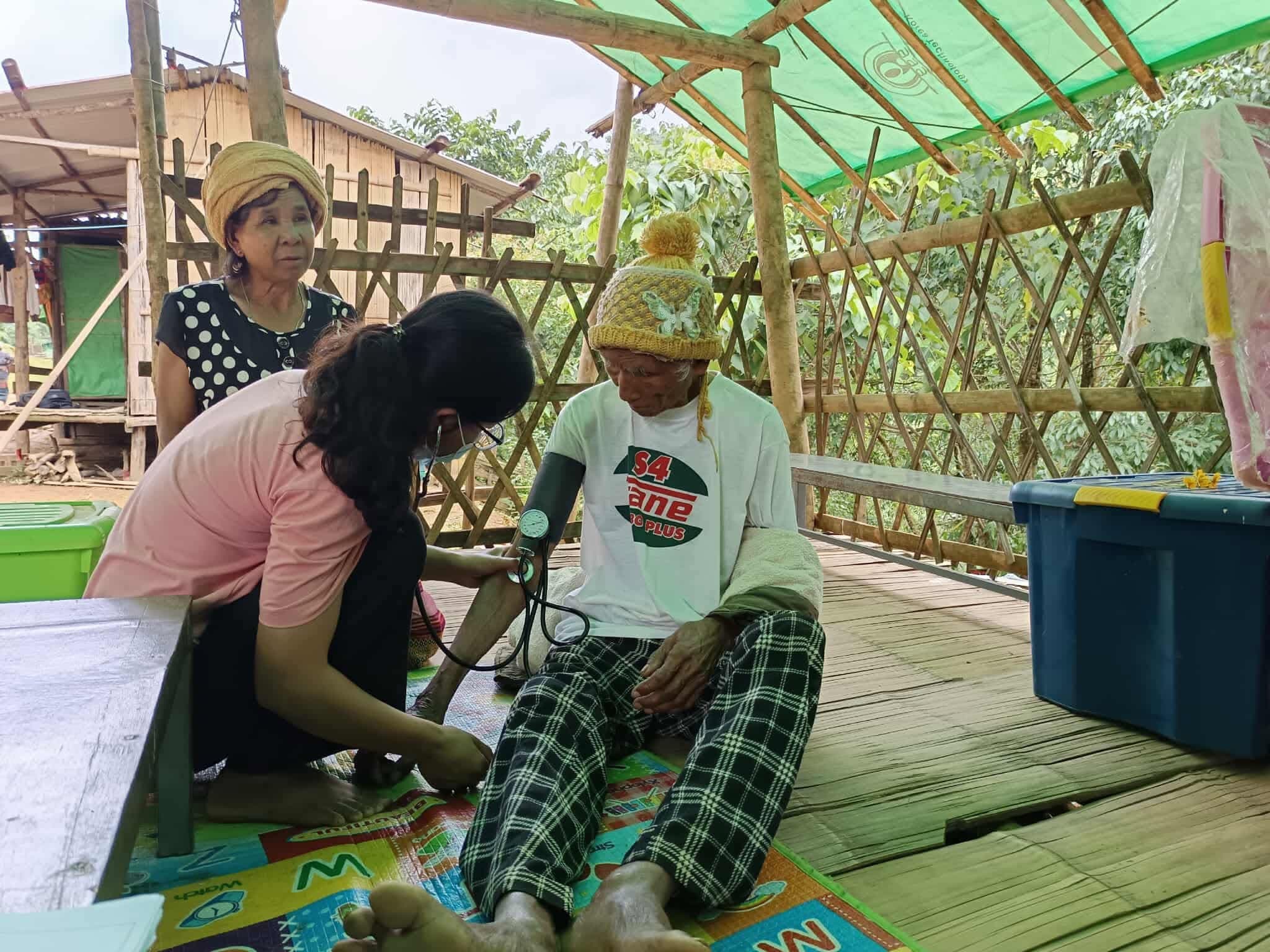 Health worker providing maternal care in a rural village