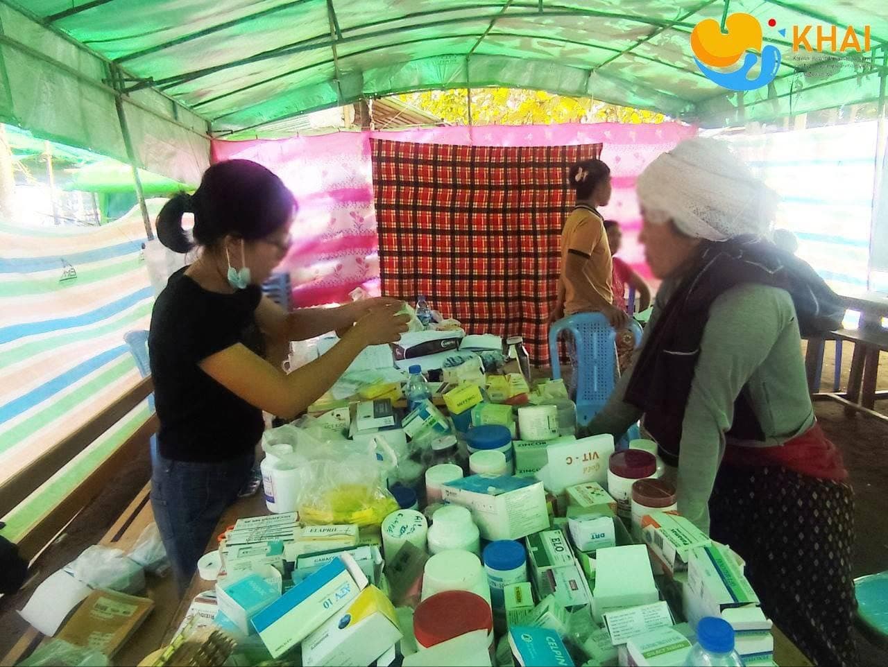 Mobile health clinic vehicle parked at a village